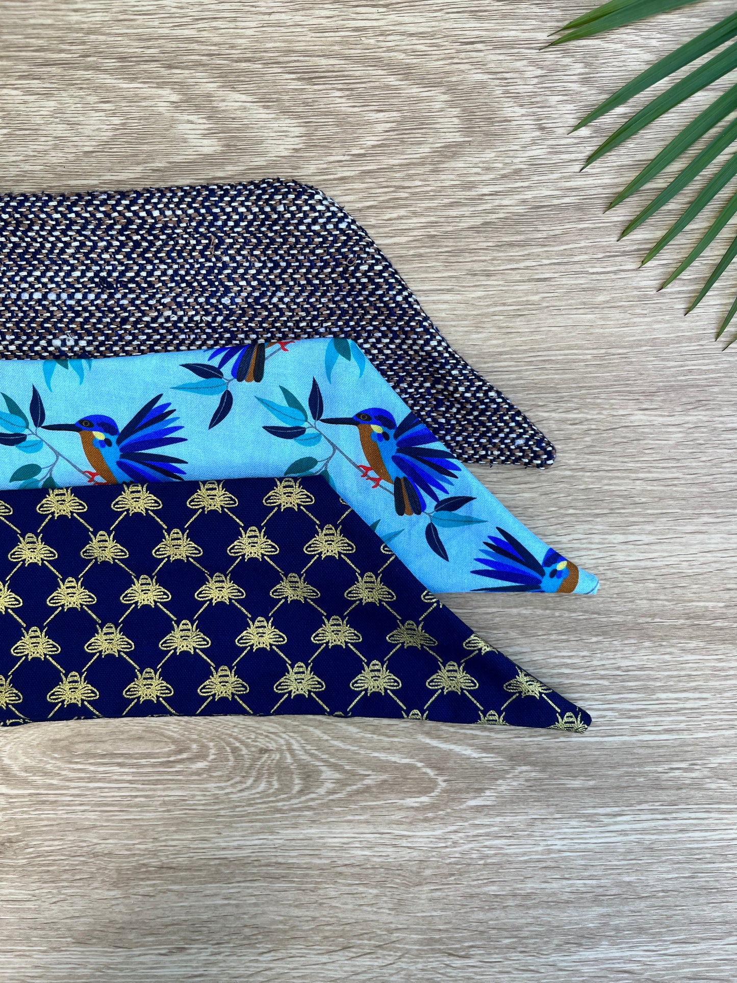 Blue wire headband with a golden bee pattern